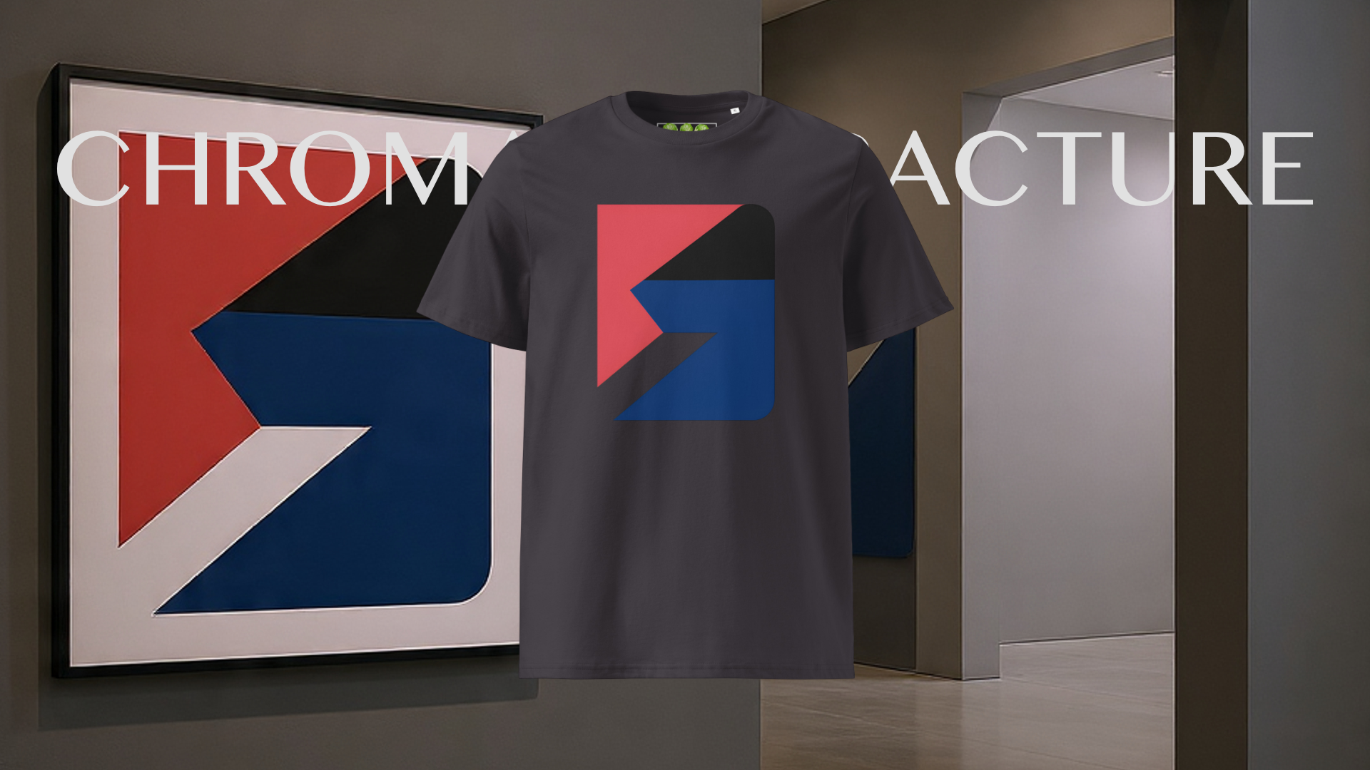 Grey Chromatic Fracture Organic Unisex T-shirt with colourful artwork in front of a framed abstract art piece.