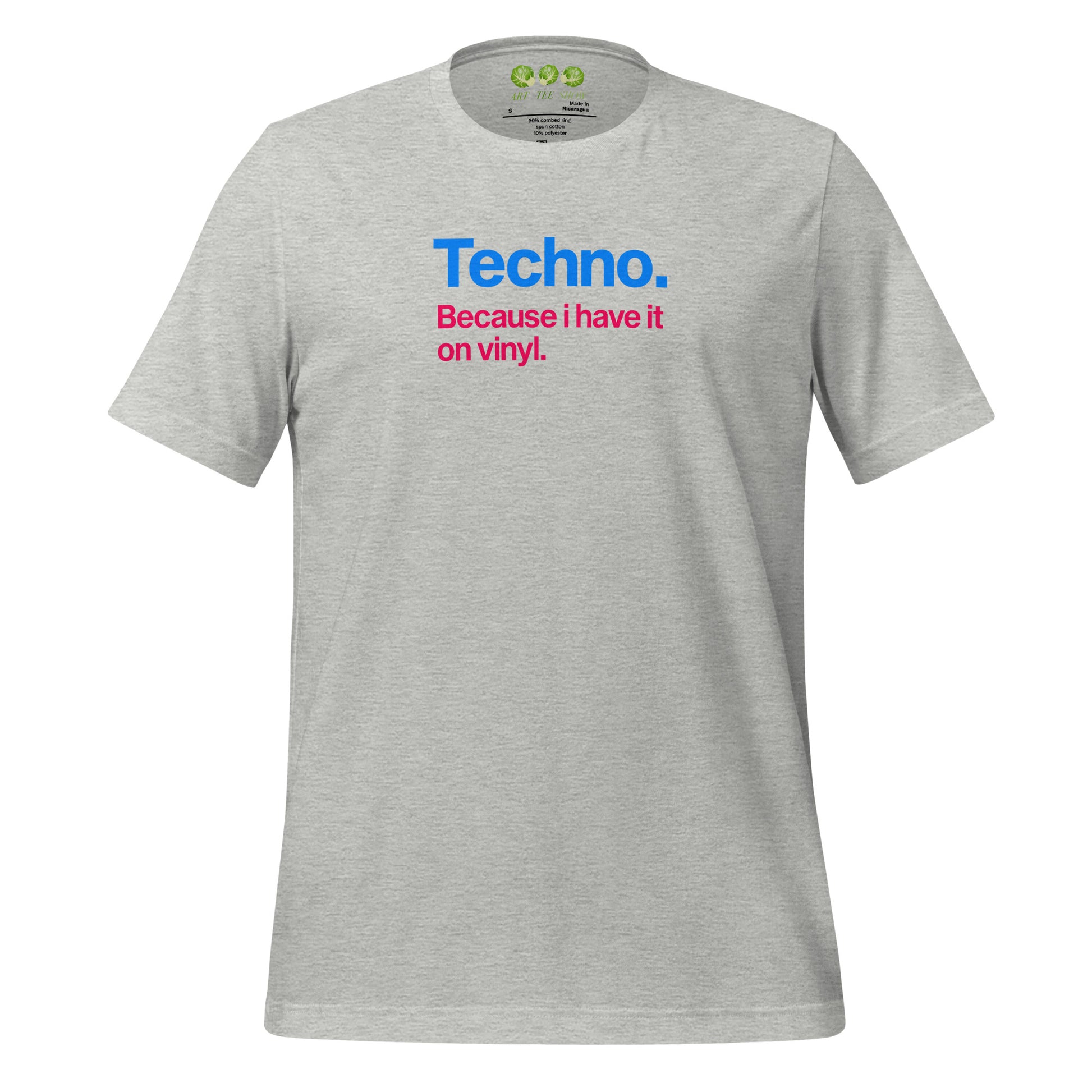 A Heather unisex t-shirt featuring minimalist typography on the chest. The text reads "Techno." in bold blue letters, followed by the subtext "Because i have it on vinyl." in pink. Designed for electronic music fans and vinyl collectors.
